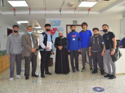 GR-12-Boys giving donation at Sharjah City for HumanitarianServices